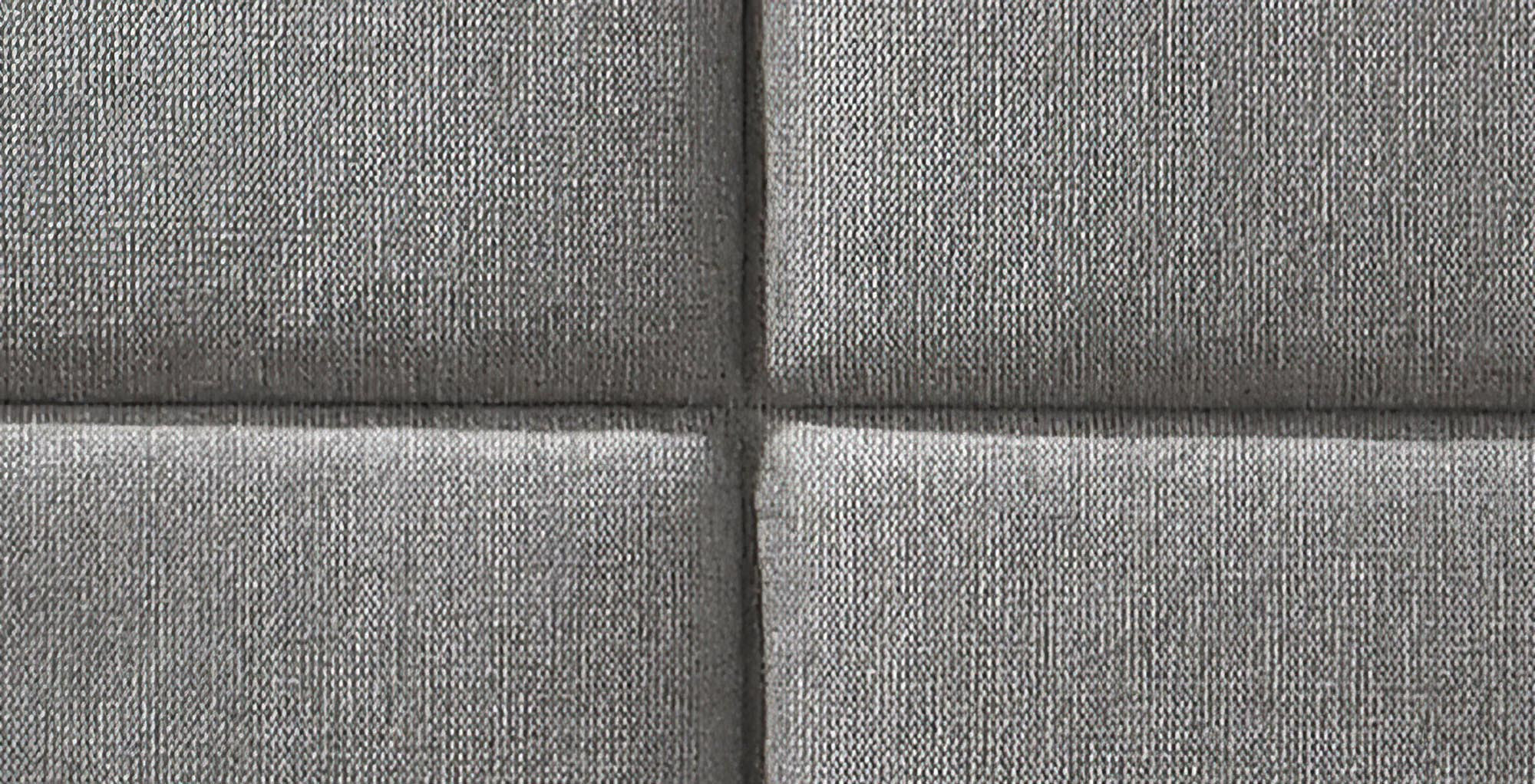 Zbliżenie na popielaty zagłówek dwuosobowego łóżka LEVANTER z pikowanym wzorem.