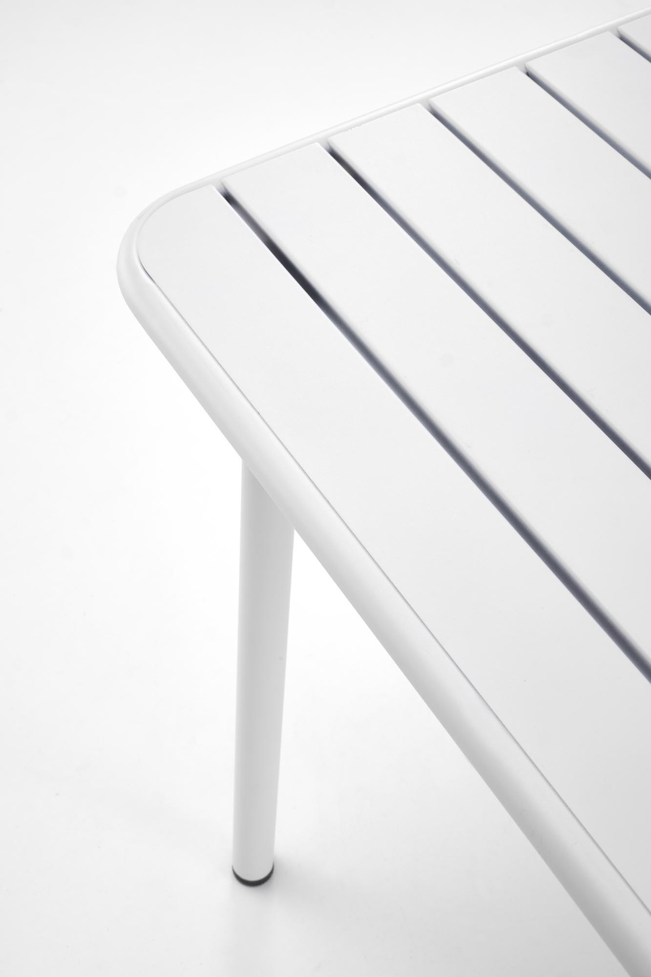 Zbliżenie na biały stalowy stół BOSCO z prostokątnym blatem i okrągłymi nogami.