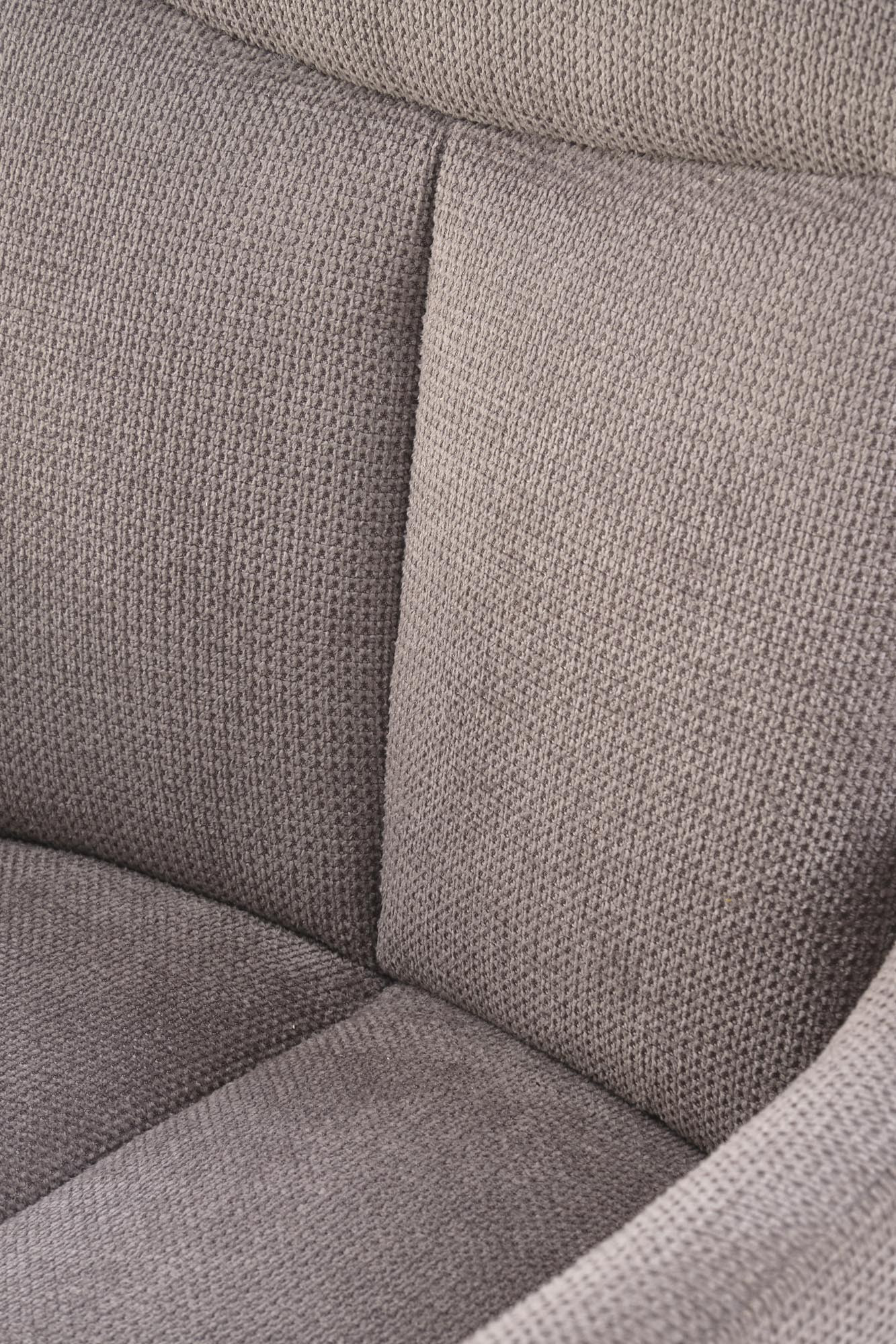 Zbliżenie na szarą tapicerkę krzesła obrotowego K536 z tkaniny Vardo.