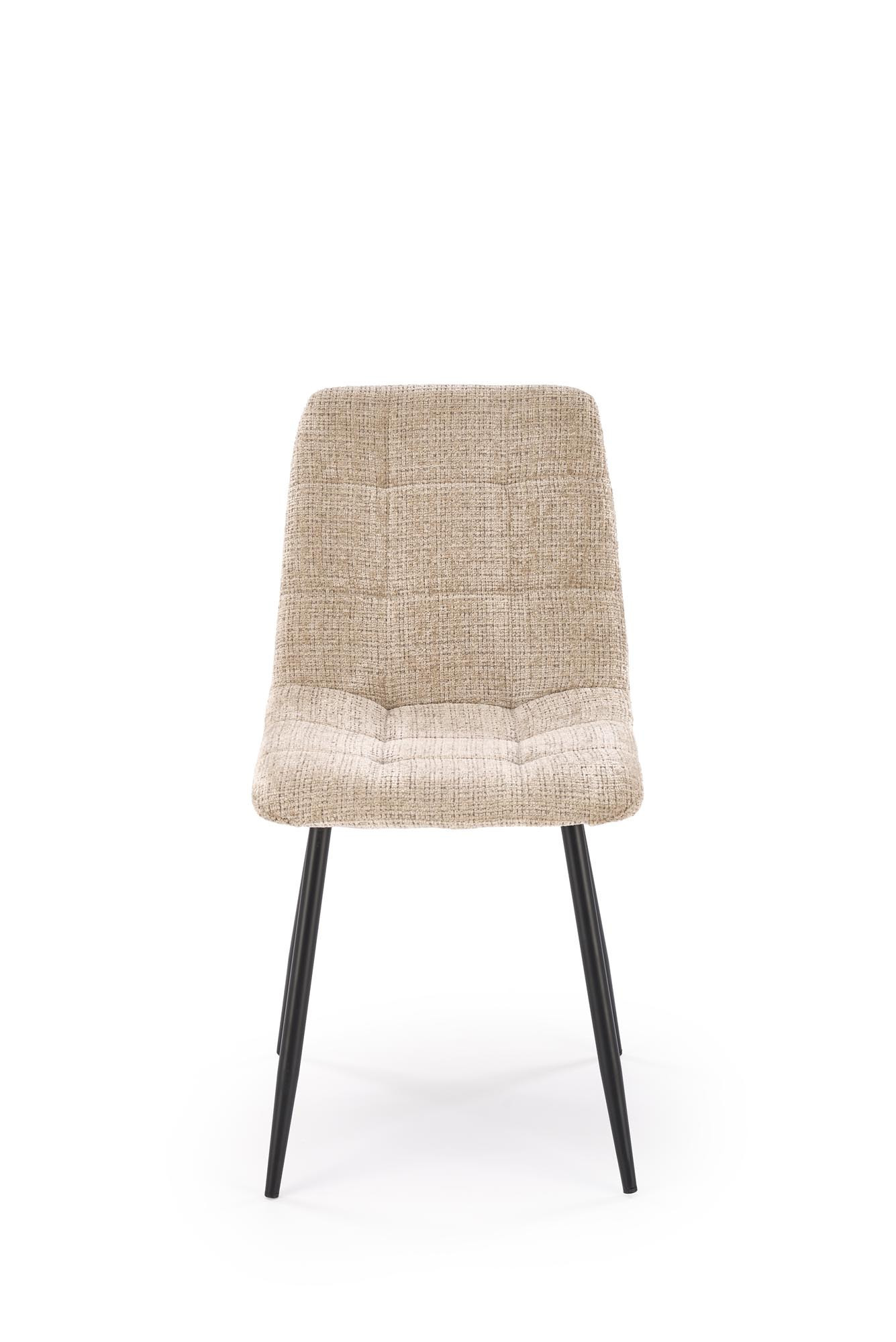 Beżowe krzesło K547 z czarnymi stalowymi nogami – widok z przodu.