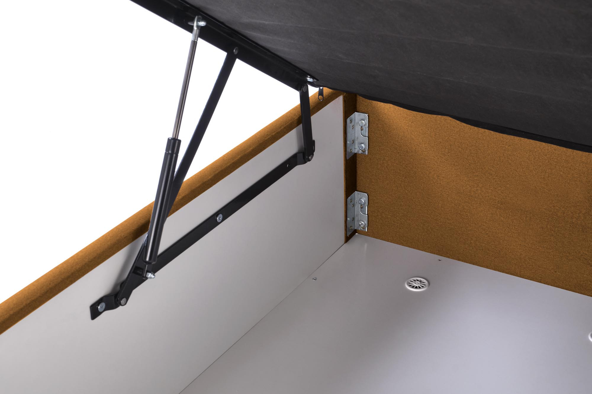 Zbliżenie na mechanizm podnoszenia łóżka kontynentalnego ASENTO 160x200 cm w kolorze musztardowym.